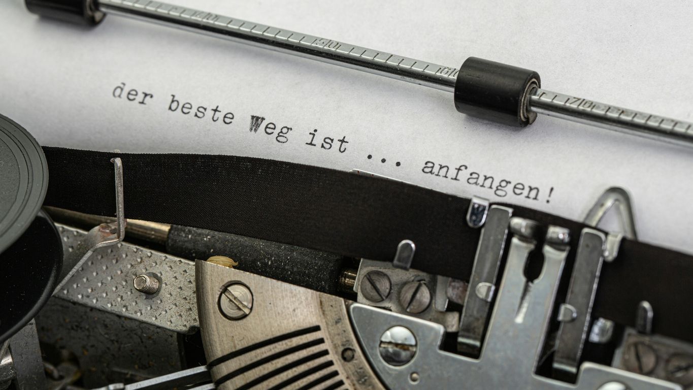 black and gray typewriter on white printer paper